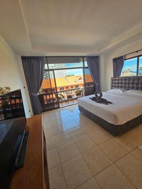 Postel nebo postele na pokoji v ubytování Candy Beach Seaview Jomtien