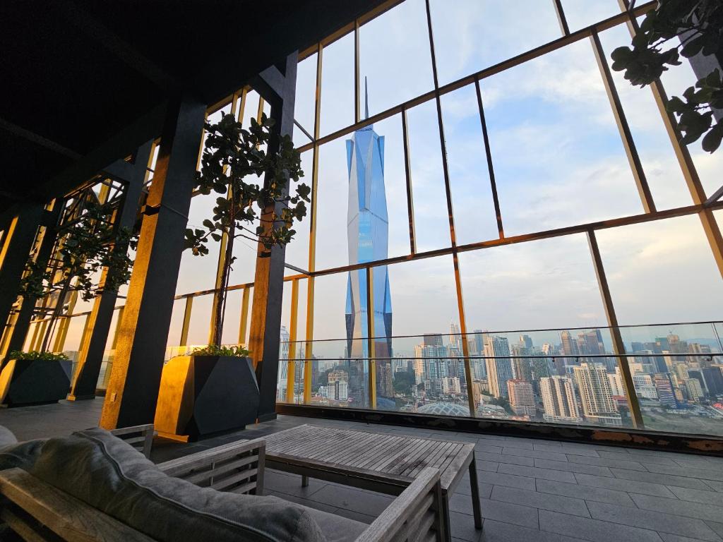 a room with a view of the burj khalifa from a building at Opus Residences by Star Haven in Kuala Lumpur