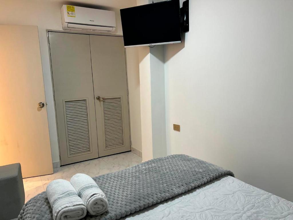 Postel nebo postele na pokoji v ubytování Provenza Medellin Hotel Boutique