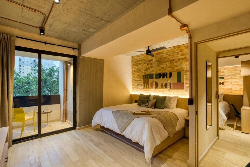 Postel nebo postele na pokoji v ubytování Caliza Roma Residences by Tasman