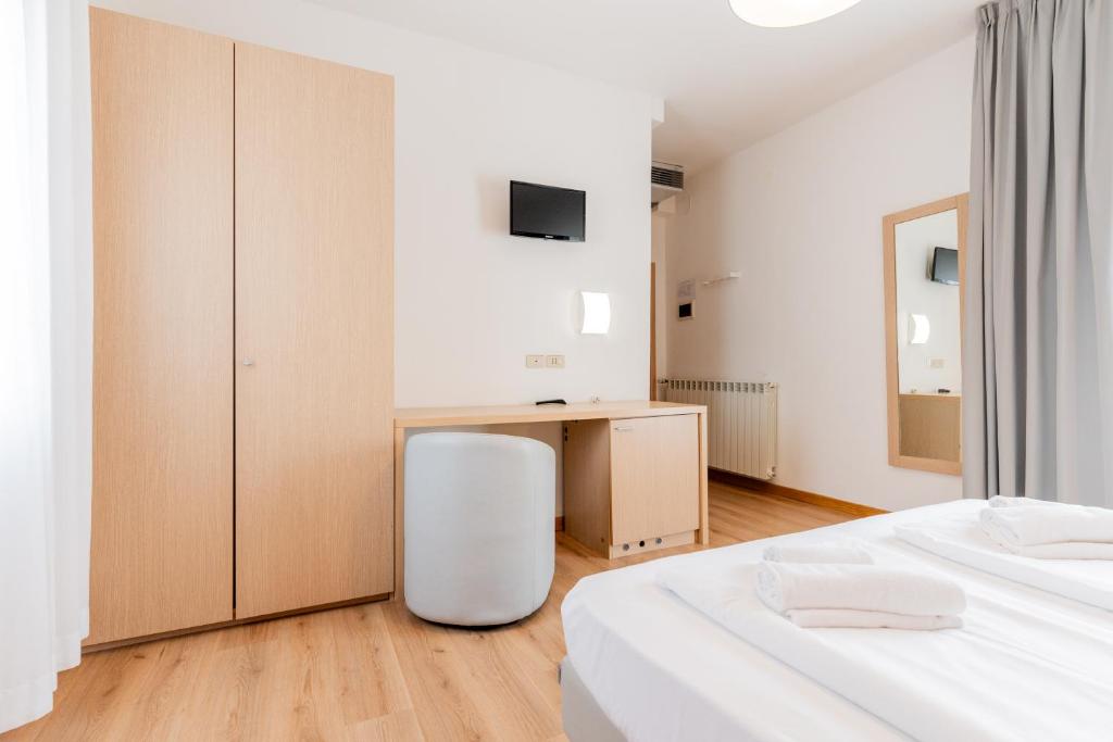 Postel nebo postele na pokoji v ubytování Hotel Regina