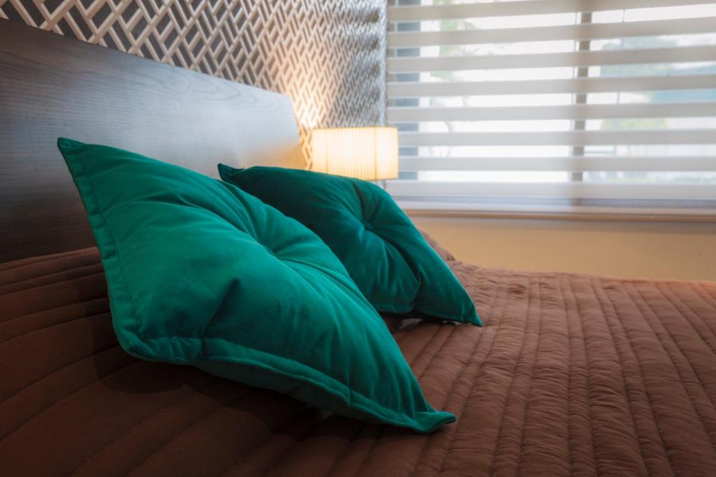 Postel nebo postele na pokoji v ubytování Hotel Platino Expo Guadalajara