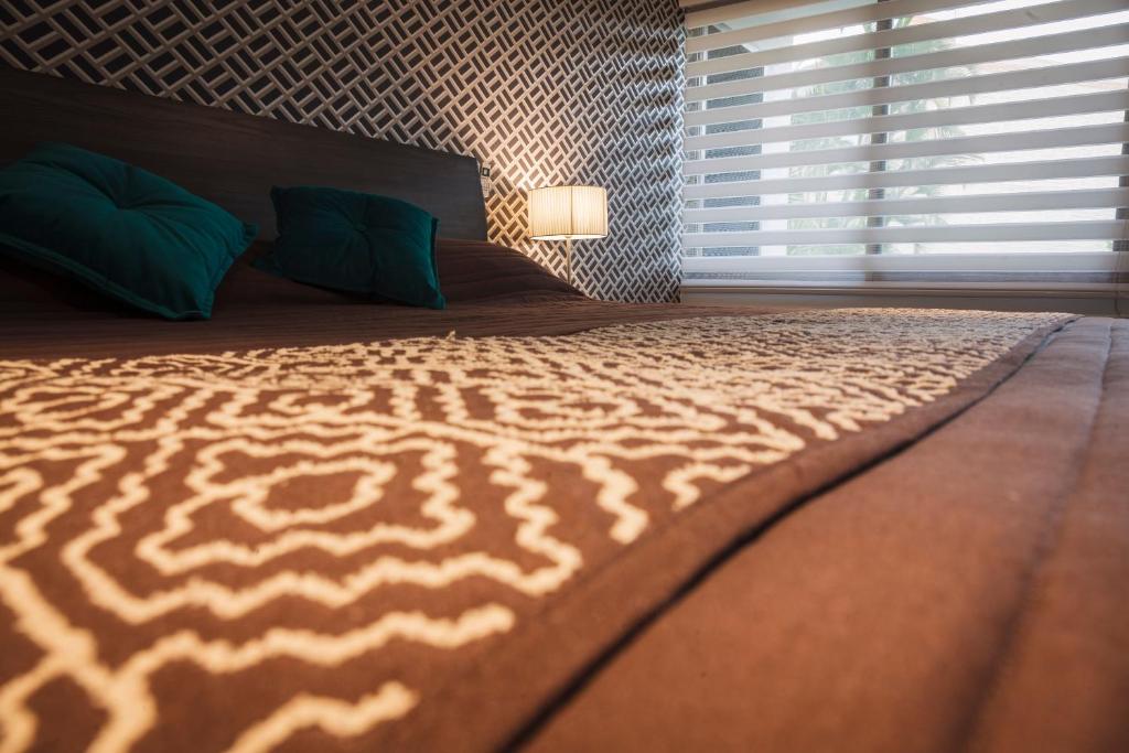 Postel nebo postele na pokoji v ubytování Hotel Platino Expo Guadalajara