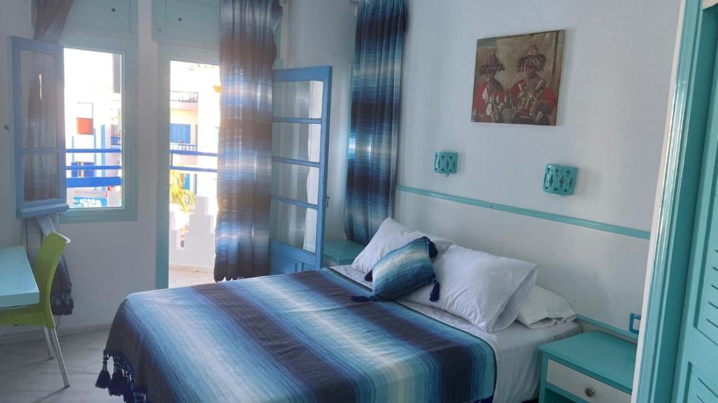 Postel nebo postele na pokoji v ubytování Hôtel Etoile de Mer