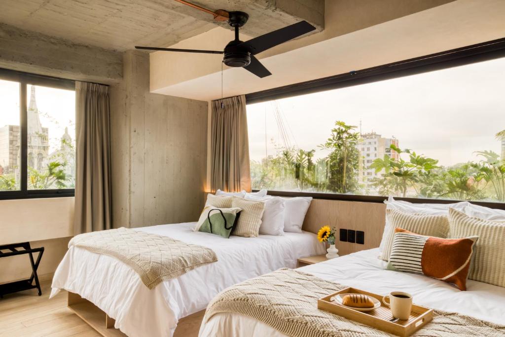 Postel nebo postele na pokoji v ubytování Caliza Roma Residences by Tasman