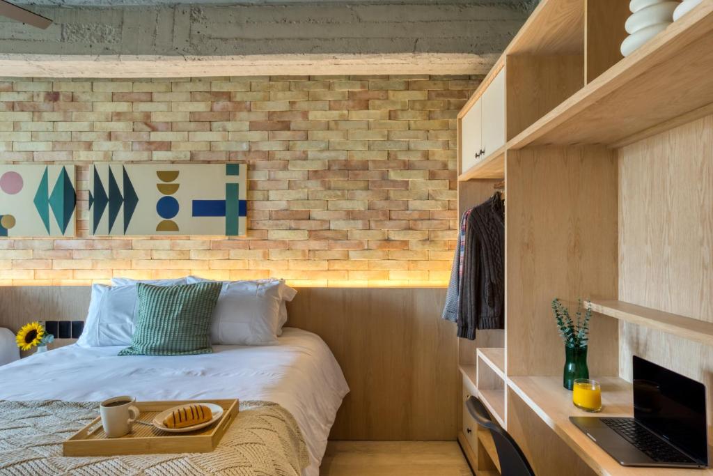Postel nebo postele na pokoji v ubytování Caliza Roma Residences by Tasman