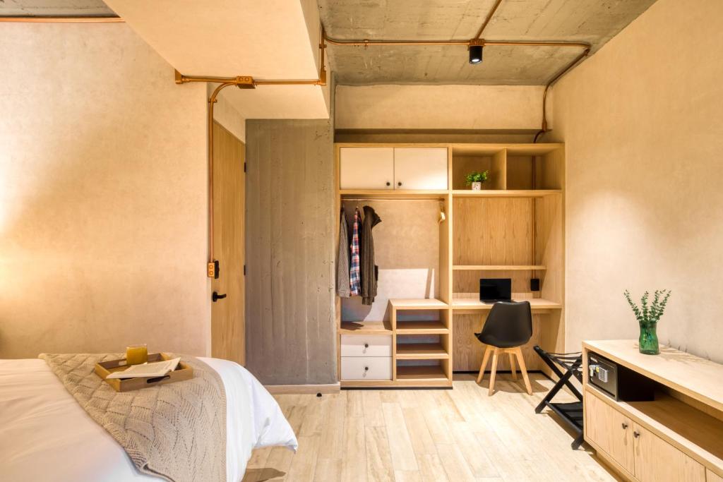 Postel nebo postele na pokoji v ubytování Caliza Roma Residences by Tasman