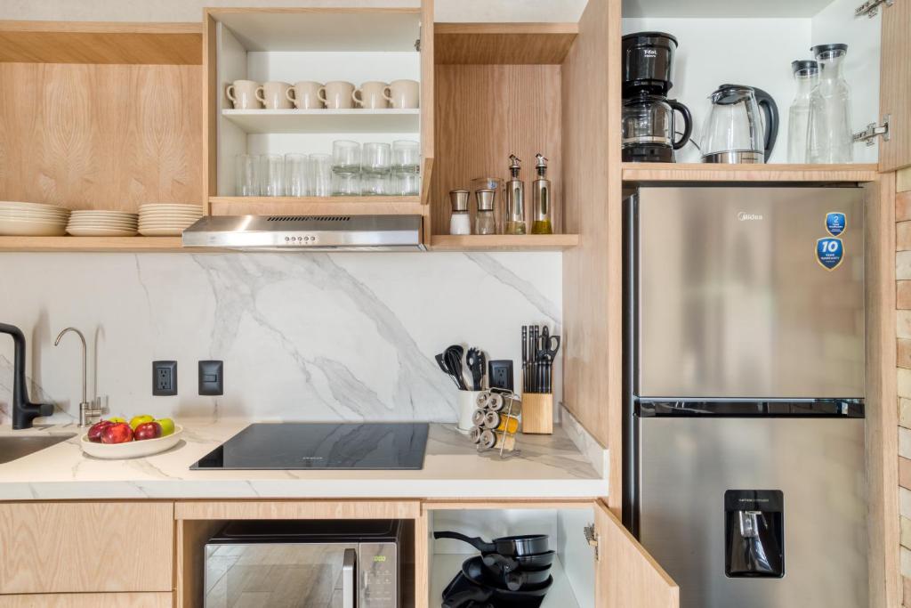 Kuchyň nebo kuchyňský kout v ubytování Caliza Roma Residences by Tasman