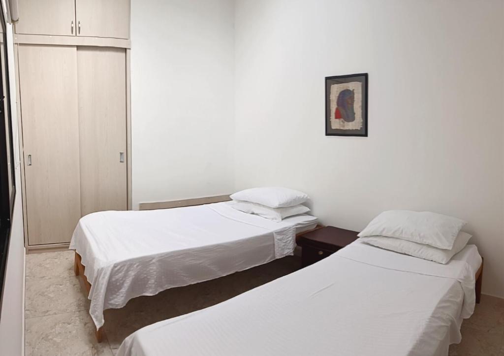 Voodi või voodid majutusasutuse Comodas y agradables Habitaciones en Chipre toas