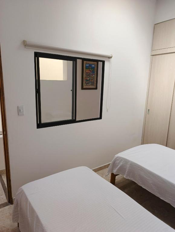 Voodi või voodid majutusasutuse Comodas y agradables Habitaciones en Chipre toas