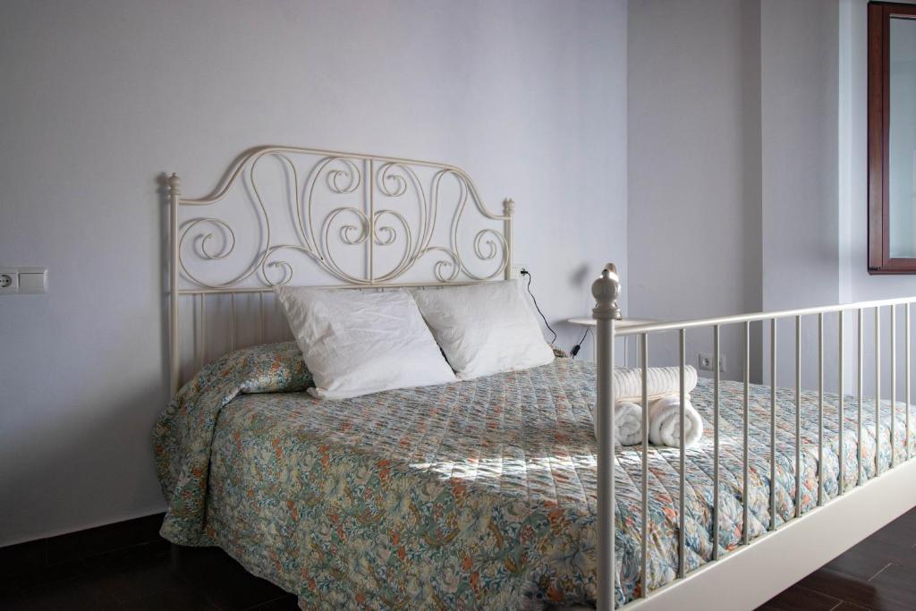 En eller flere senge i et værelse på Apartamento El Mirador del Parque