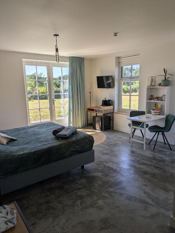 TV a/nebo společenská místnost v ubytování Bed no breakfast de Kapitein