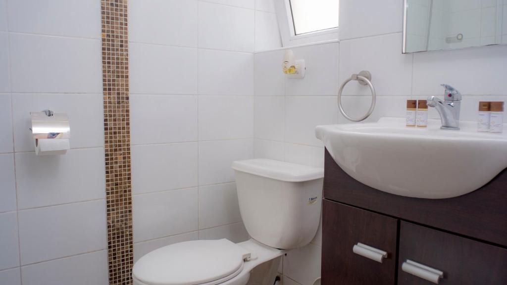 Koupelna v ubytování Riomar Apart Hotel