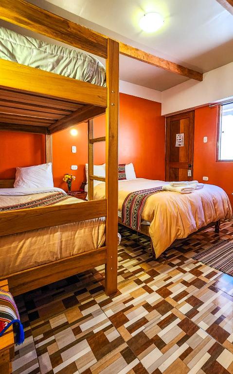 Postel nebo postele na pokoji v ubytování PERU QUECHUA'S LODGE Riverside