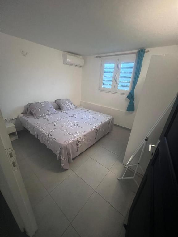 Postel nebo postele na pokoji v ubytování Logement Campagne Coquelicots Plaisance