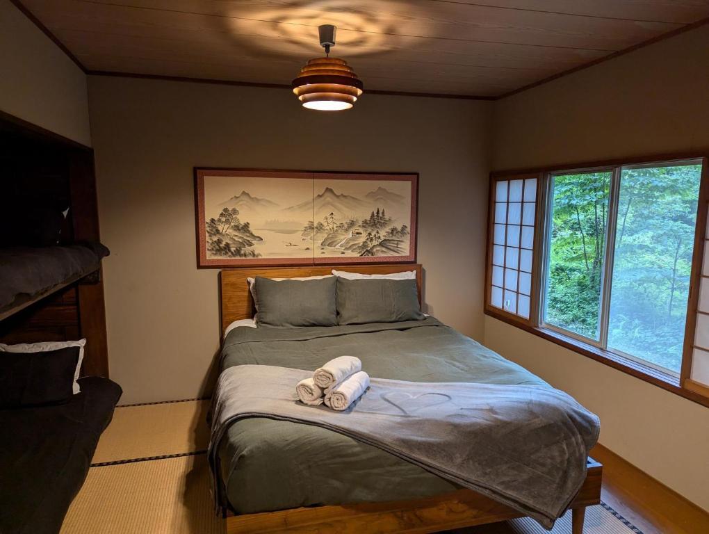 Postel nebo postele na pokoji v ubytování Mountain Hut Myoko