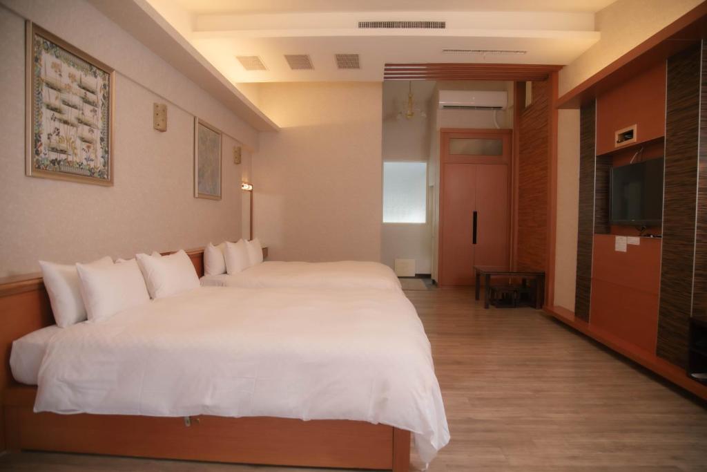 Postel nebo postele na pokoji v ubytování Guanziling Lin Kuei Yuan Hot Spring Resort
