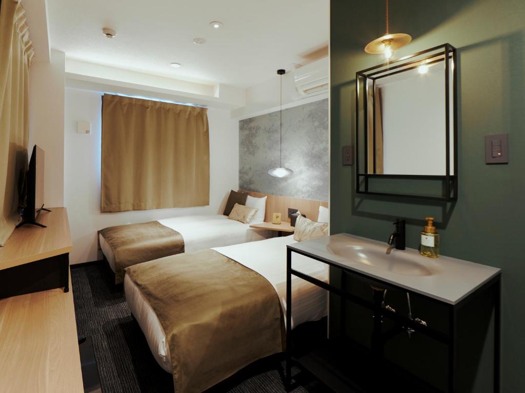R Hotel Namba Daikokuchoにあるベッド