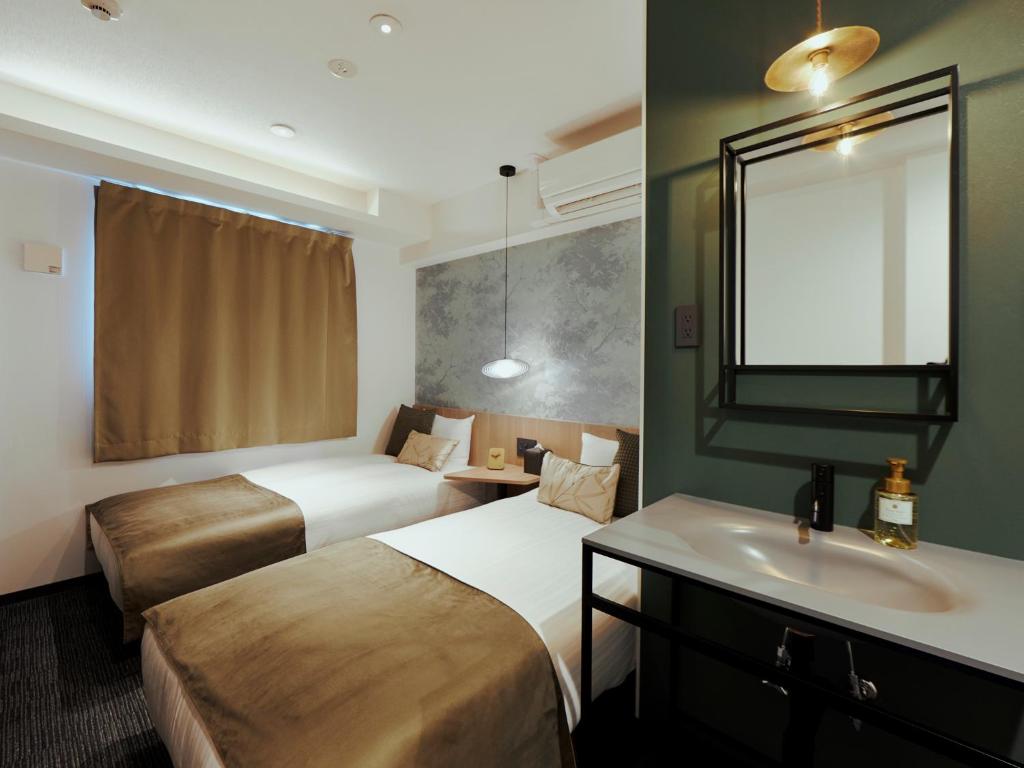 R Hotel Namba Daikokuchoにあるベッド