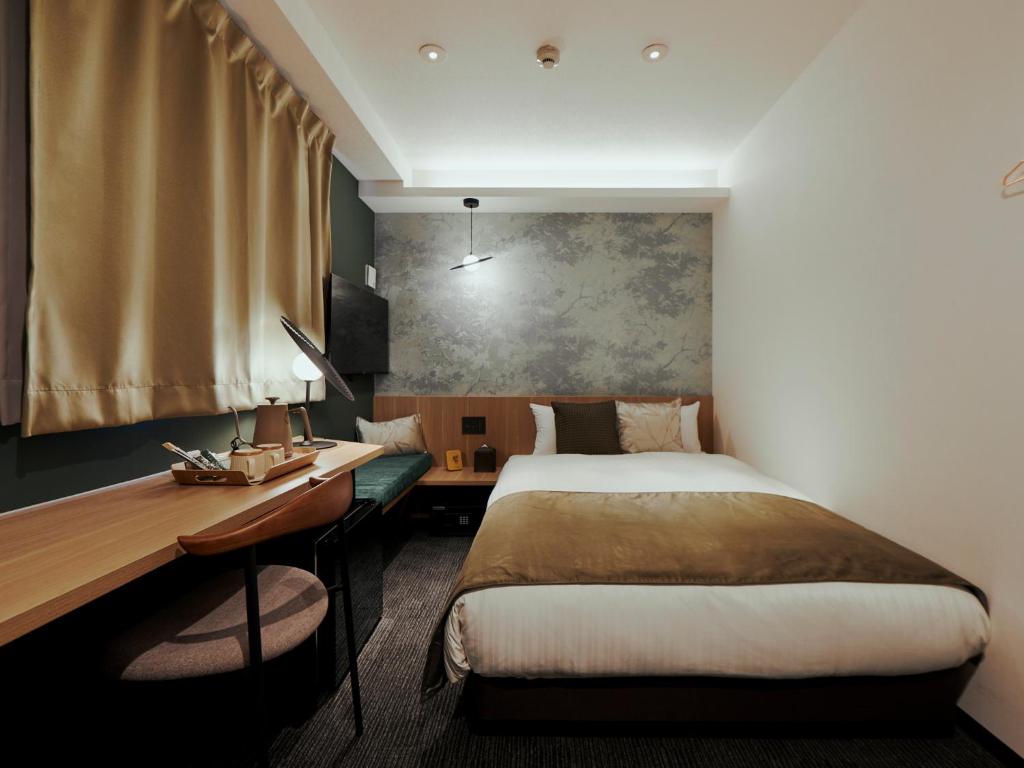 R Hotel Namba Daikokuchoにあるベッド