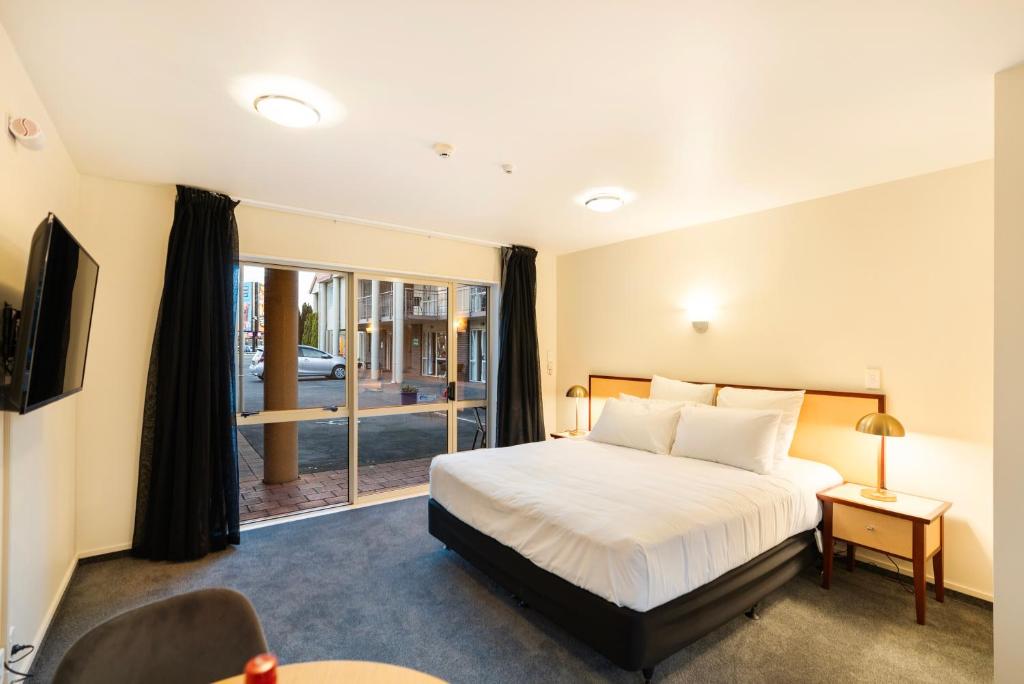 Postel nebo postele na pokoji v ubytování Daffodil Motel