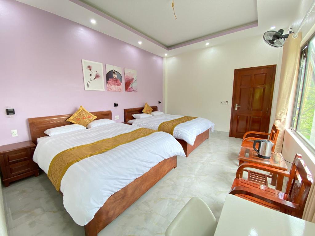 Postel nebo postele na pokoji v ubytování Van Anh Hotel - Restaurant