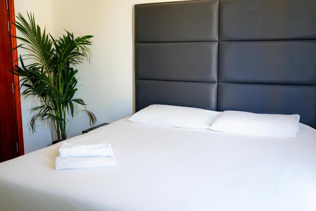 Postel nebo postele na pokoji v ubytování Valhalla Boutique Hotel