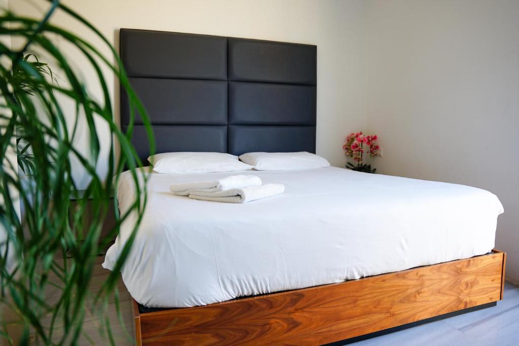 Postel nebo postele na pokoji v ubytování Valhalla Boutique Hotel