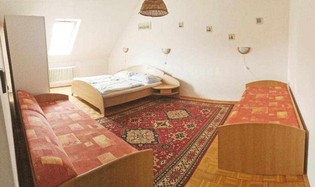 Postel nebo postele na pokoji v ubytování Dom pod zámkom