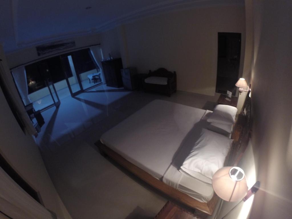 Postel nebo postele na pokoji v ubytování Ubud Wins Bungalow