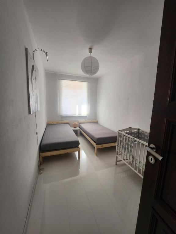 Postel nebo postele na pokoji v ubytování Apartmán Julie