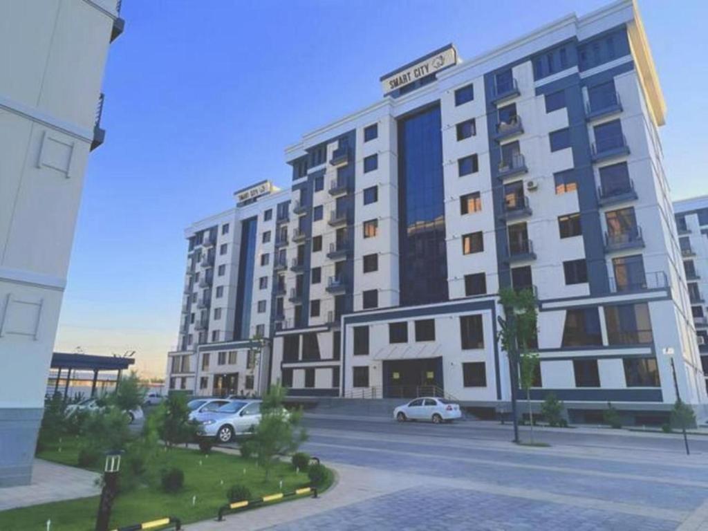 a rendering of a large building with cars parked in front at Harmony Homestay in Samarkand