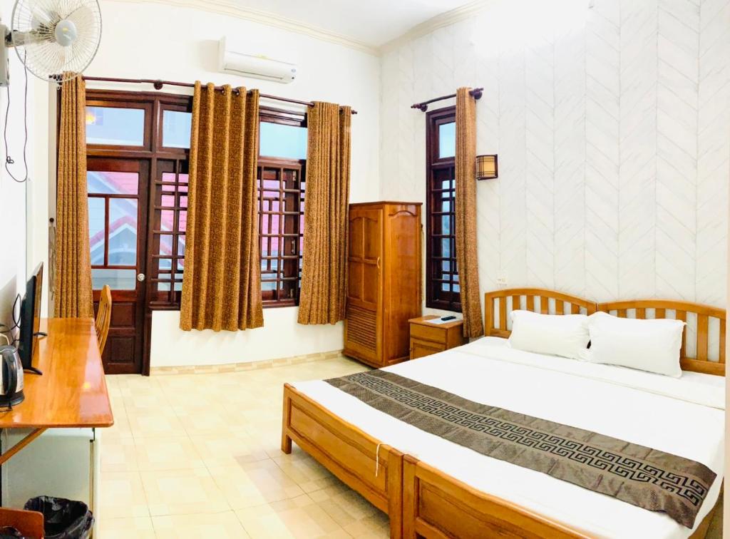 Giường trong phòng chung tại Chào Hotel Mũi Né
