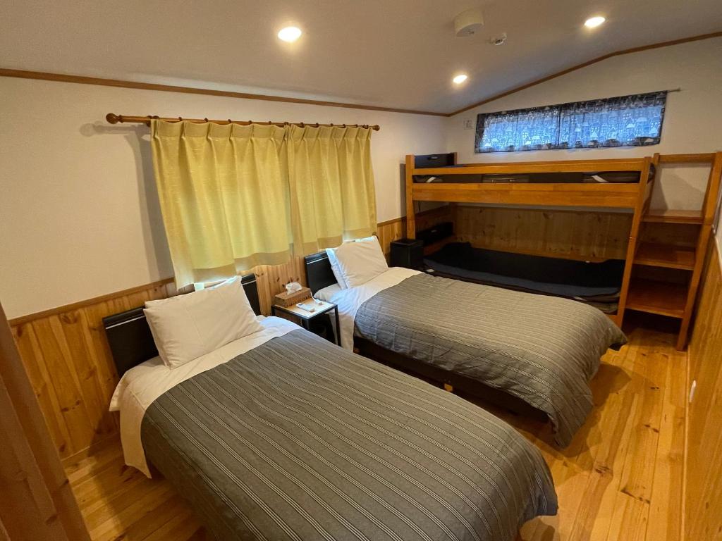 Postel nebo postele na pokoji v ubytování Villa Orange Cabin