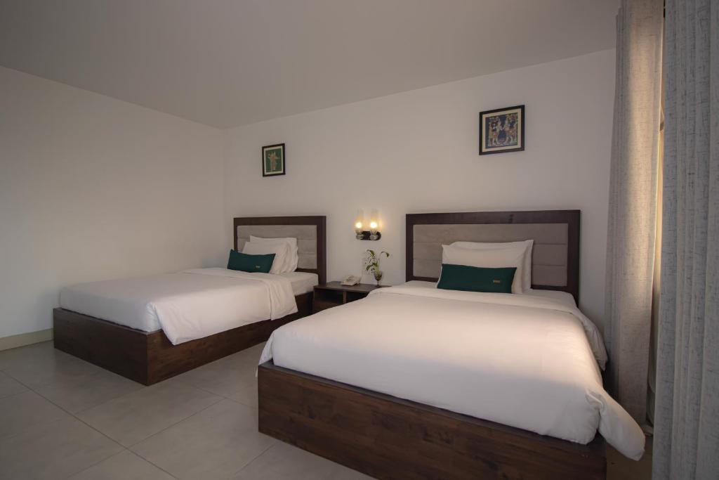 Postel nebo postele na pokoji v ubytování Vrest Hotel