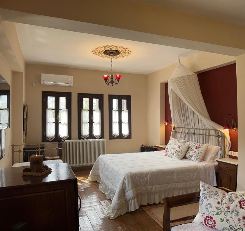 Postel nebo postele na pokoji v ubytování Guesthouse Filokalia