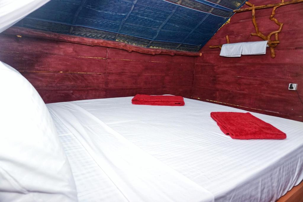 Postel nebo postele na pokoji v ubytování Rana Treehouse