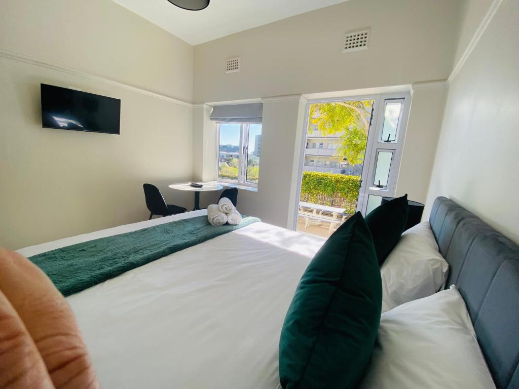 Ένα ή περισσότερα κρεβάτια σε δωμάτιο στο @Nine