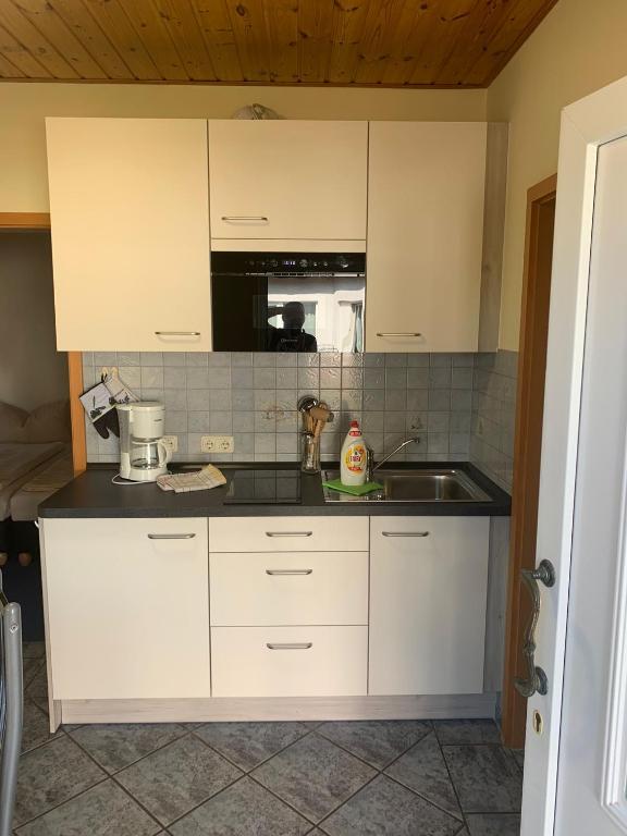 Kuchyň nebo kuchyňský kout v ubytování Ferienwohnung Wede