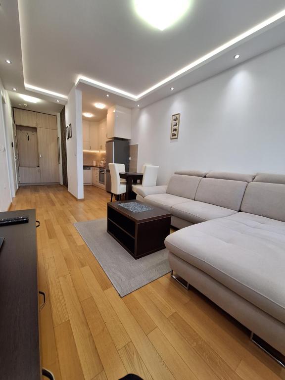 a living room with a couch and a table at DRAGAm in Banja Luka
