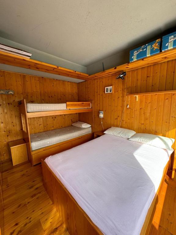Postel nebo postele na pokoji v ubytování Casetta al Sole Alto