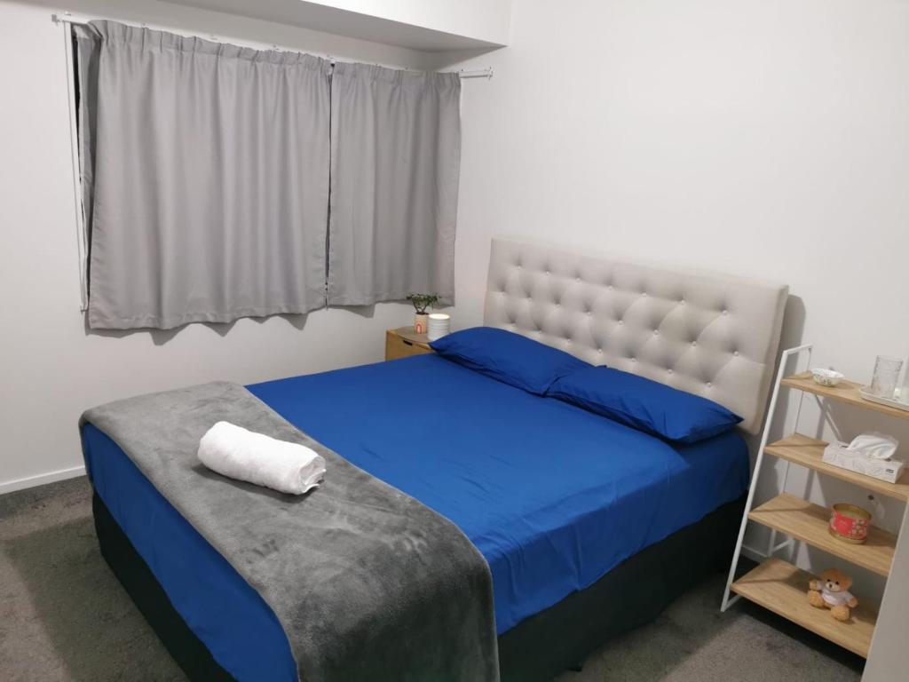 Postel nebo postele na pokoji v ubytování Manukau Room Accommodation