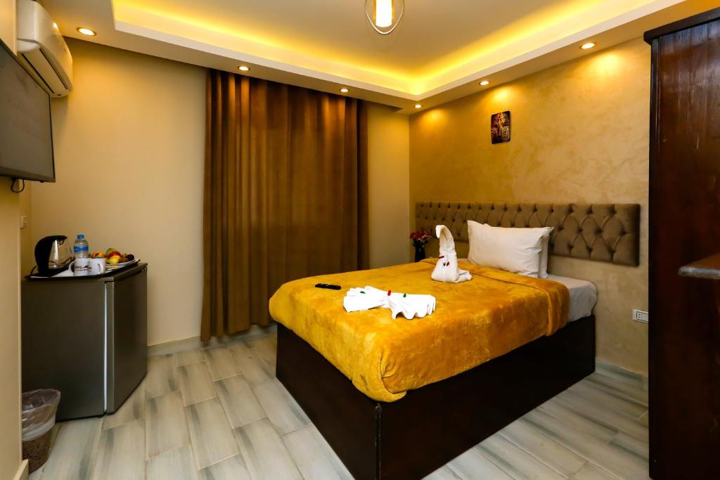 Postel nebo postele na pokoji v ubytování Venus Pyramids-Guest House