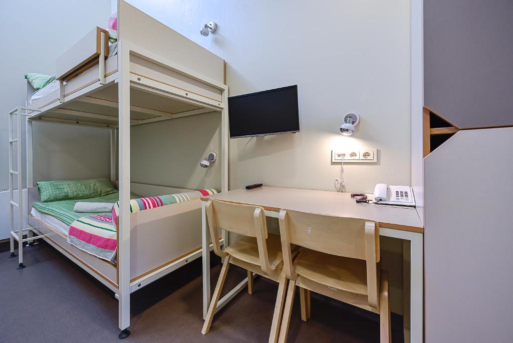 Postel nebo postele na pokoji v ubytování Nykščio Hostel