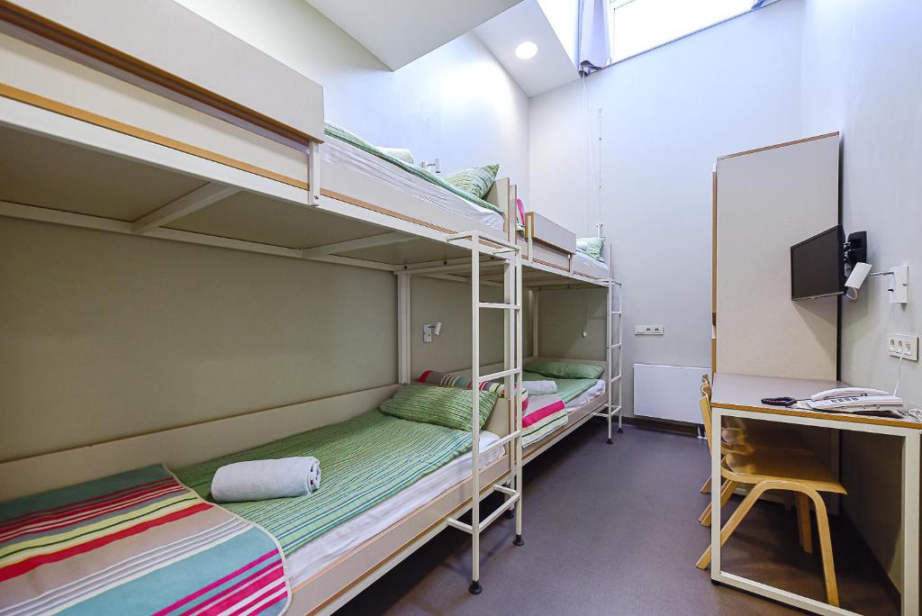 Postel nebo postele na pokoji v ubytování Nykščio Hostel