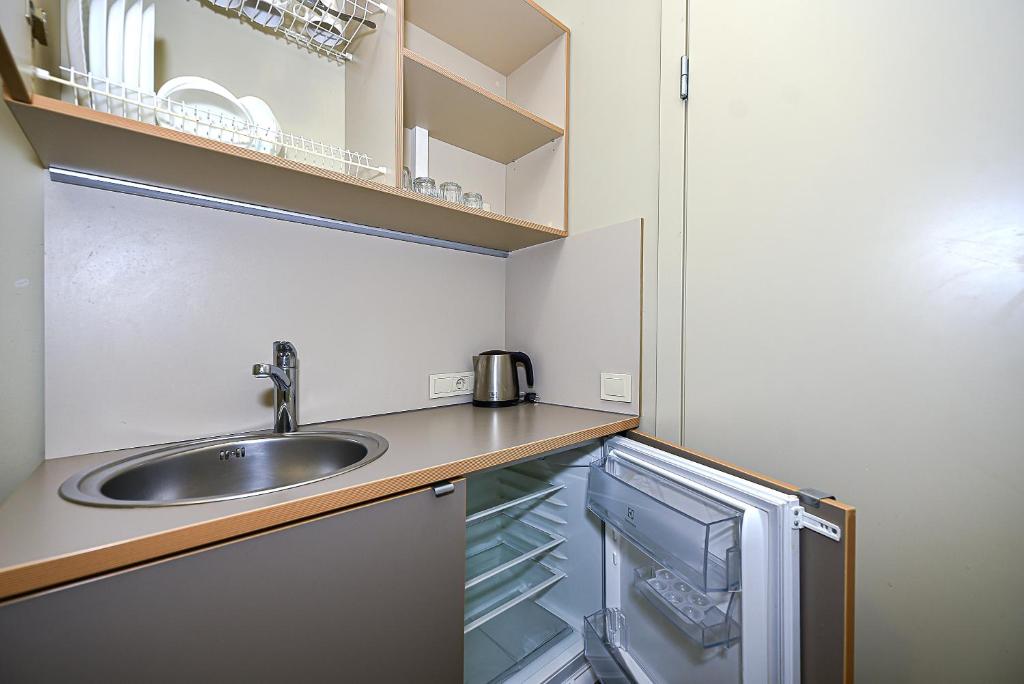 Kuchyň nebo kuchyňský kout v ubytování Nykščio Hostel