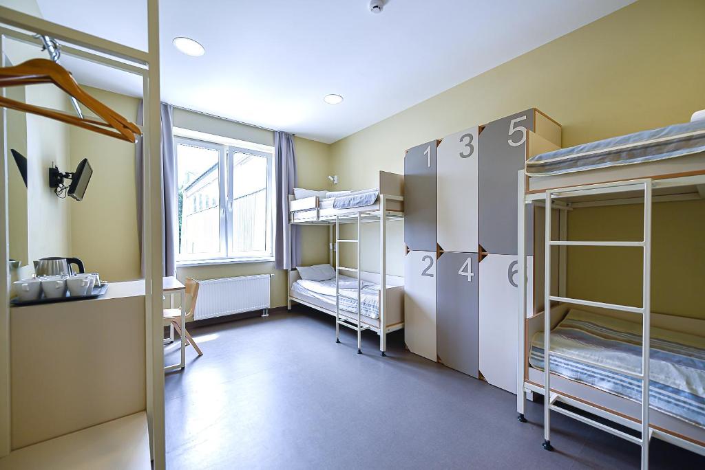 Postel nebo postele na pokoji v ubytování Nykščio Hostel