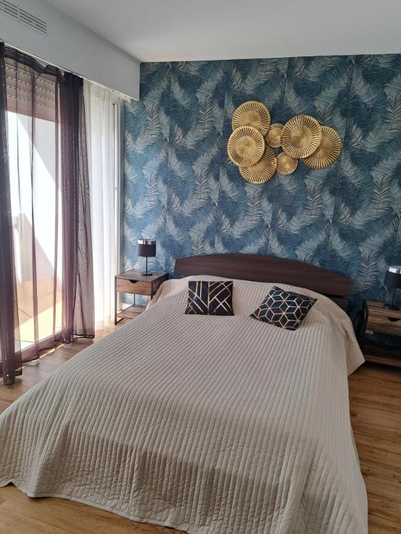 Ένα ή περισσότερα κρεβάτια σε δωμάτιο στο Appartement Cosy à Ales aux pieds des Cévennes