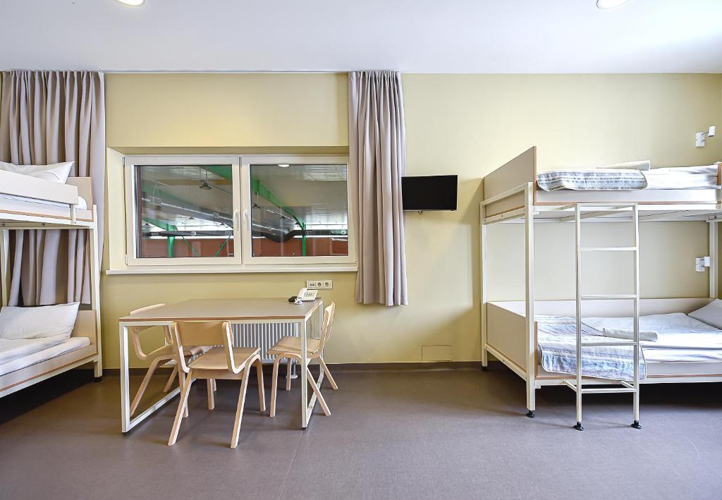 Postel nebo postele na pokoji v ubytování Nykščio Hostel