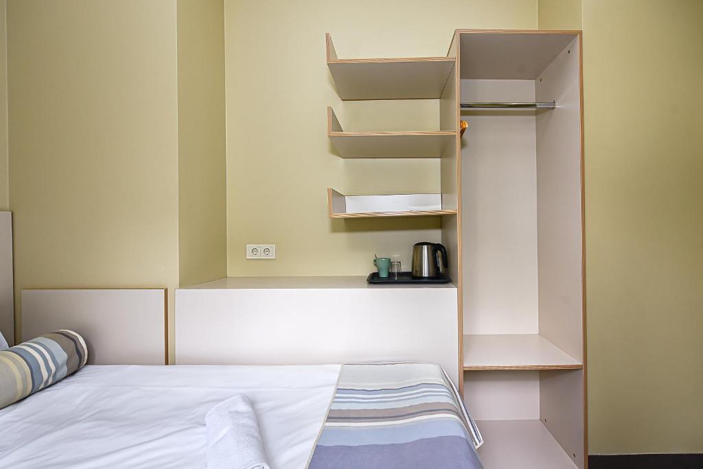 Postel nebo postele na pokoji v ubytování Nykščio Hostel
